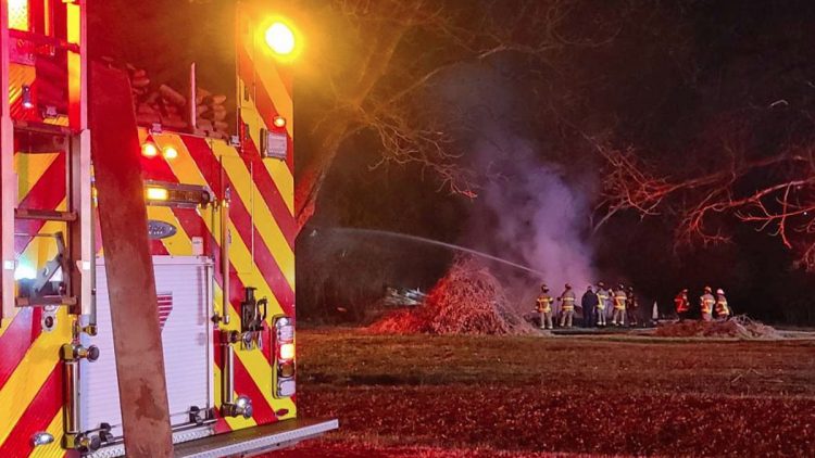 Flames engulf storage building in local neighborhood