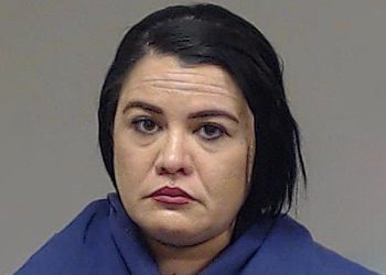 Woman tricked younger woman into living with her and her family, only to take her captive and starve the woman, lock her in a cage and severely burn her arms, chst and back by pouring a pot of boiling water on her; sentenced