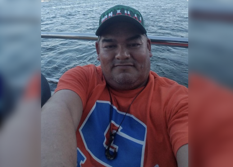 Huband, while in the same bed with his little daughter, tried to hug his wlfe two times before grabbing a hunting knife and stabbing the woman to death because she pushed him away twice, told police the attempted hugging was simply a test; charged