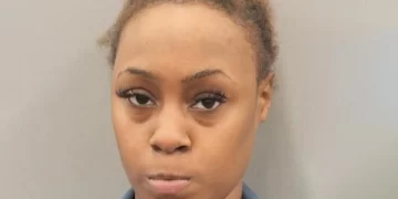 Woman claims her partner grabbed her by her coat, which is why she shot him several times, killing him, after confronting the man about the mesages he exchanged with another female; charged