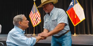 Governor Greg Abbott helps distribute flood relief funds to Hill Country families affected by catastrophic storms
