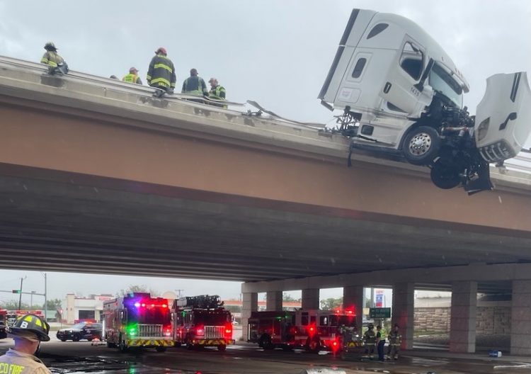 Waco firefighters rescue 18-wheeler driver after truck hangs over I-35 bridge in Elm Mott